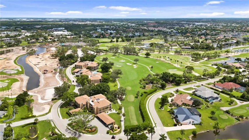 View of property location with a large body of water and nearby suburban area