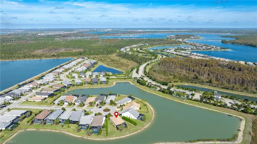 Aerial overview of property's location featuring a large body of water