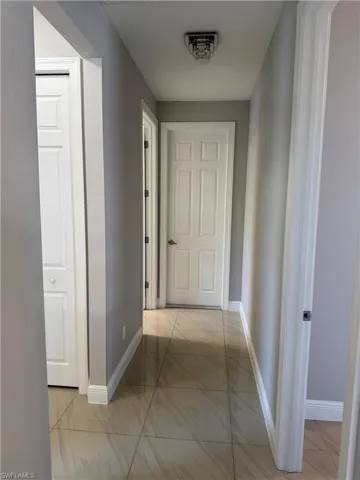 Hallway featuring rooms 2 and 3, and the laundry