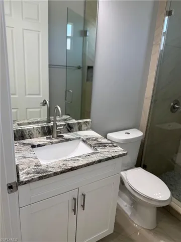 Full bath 1 with vanity and a stall shower