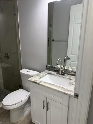 Bathroom 2 with vanity and a stall shower