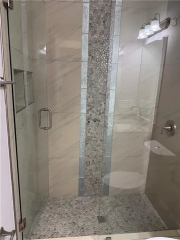 Full bath with a shower stall