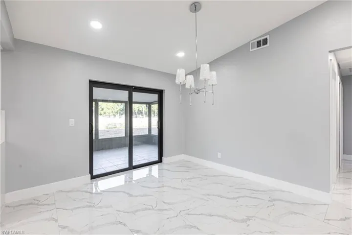 Spare room with recessed lighting, visible vents, marble finish floor, and baseboards