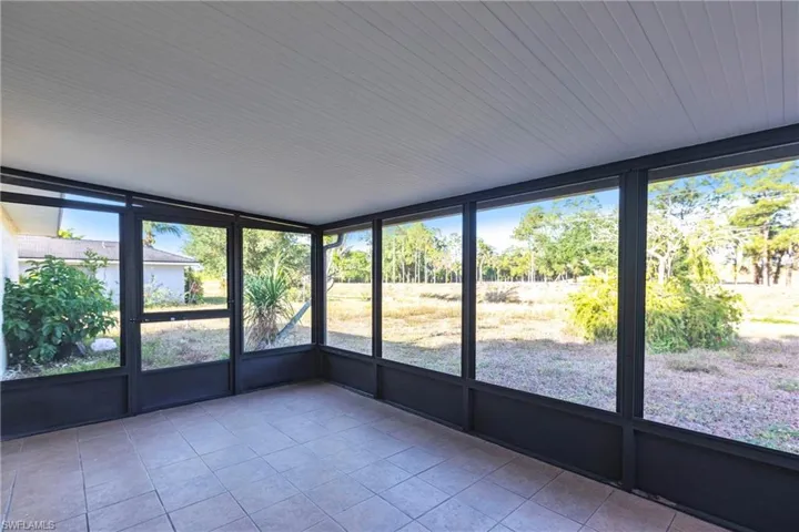 Unfurnished sunroom featuring plenty of natural light