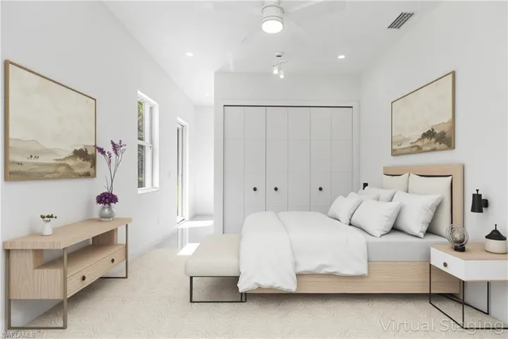 Virtual staged - Guest bedroom featuring a ceiling fan, recessed lighting, and a closet