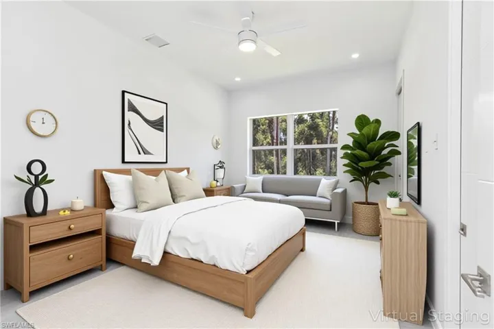 Virtual staged - Bedroom featuring a ceiling fan and recessed lighting