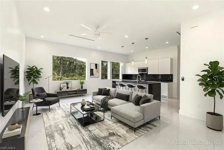Virtual staged - Living area with ceiling fan and recessed lighting