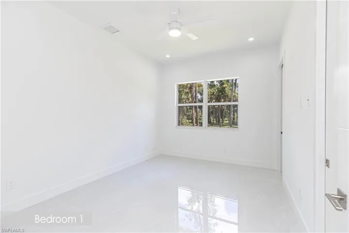 Unfurnished bedroom with baseboards, recessed lighting, marble finish floor, and a ceiling fan