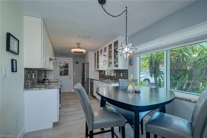 Dining space with light wood-style floors