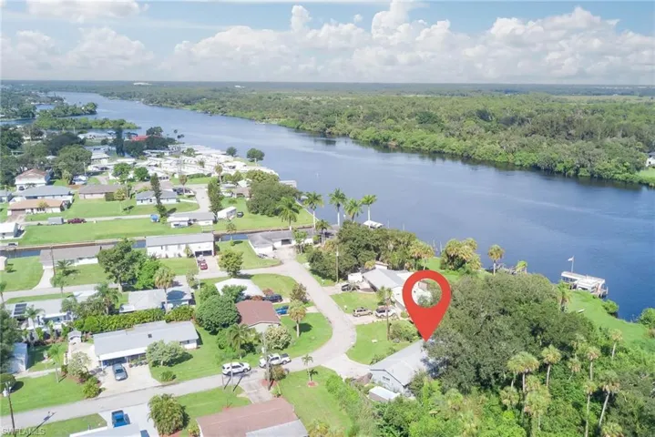View of property location featuring nearby suburban area and a large body of water
