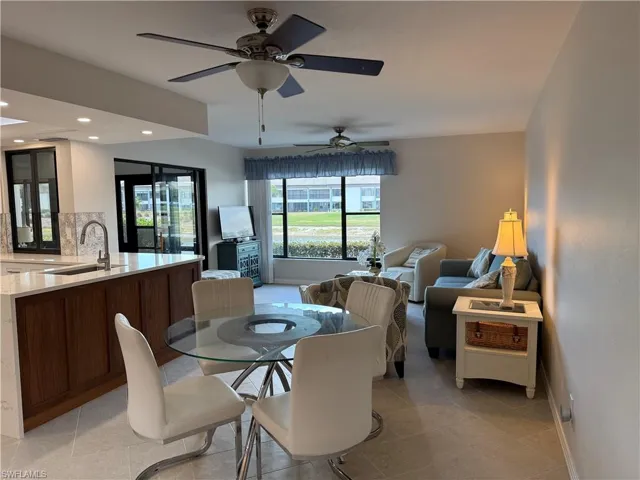 Dining room featuring recessed lighting, ceiling fan, and light tile patterned flooring