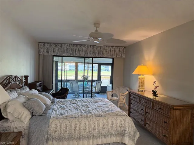 Bedroom with access to exterior and ceiling fan