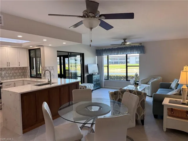 Dining room featuring recessed lighting, light tile patterned flooring, and ceiling fan