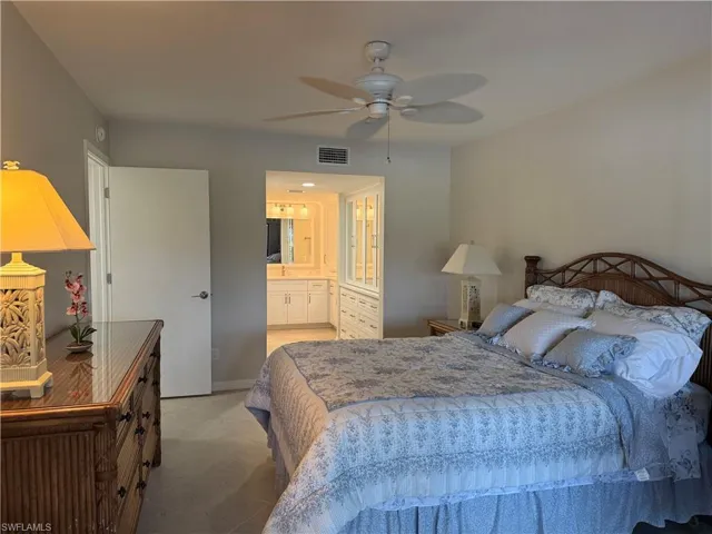 Bedroom with a ceiling fan and ensuite bathroom
