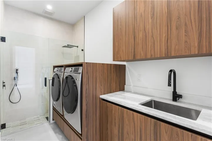 LAUNDRY ROOM has CLEANING STATION w/ HEAD & HANDHELD SHOWERS for your FURRY BABIES or extra cleaning needs, SAMSUNG MultiSteam moisture sensor SMARTthings WASHER & DRYER in CUSTOM CABINETRY, LAUNDRY TUB & custom STORAGE cabinets.
