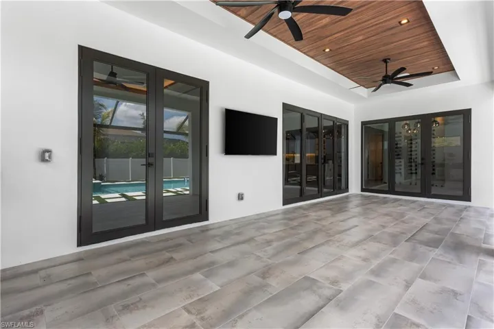 Designer fans, wood ceiling, BOSE SURROUND SOUND & 55-inch TV ensure EVERY GATHERING is MEMORABLE!