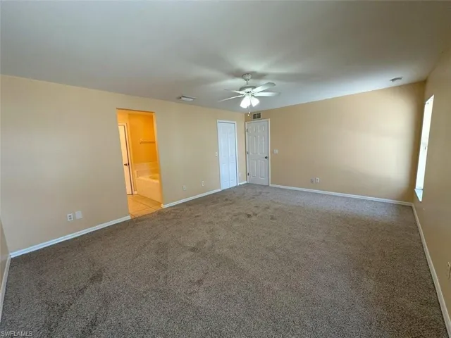 Master Bedroom featuring ceiling fan, carpet, and baseboards
