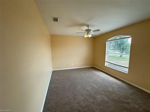 2nd Bedroom featuring a ceiling fan, carpet, and baseboards