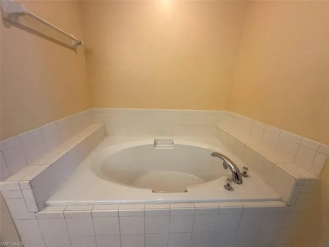 Full bathroom with a bath