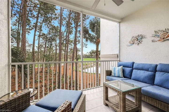 Balcony with outdoor lounge area and a ceiling fan