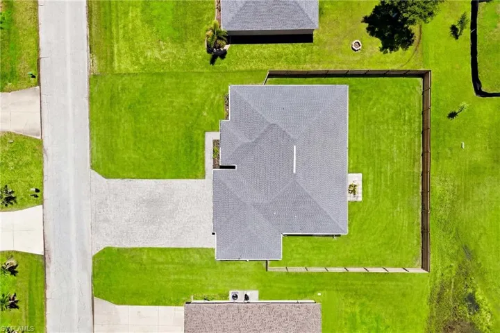 A true aerial perspective captures the home's architectural design and the care taken throughout the property.