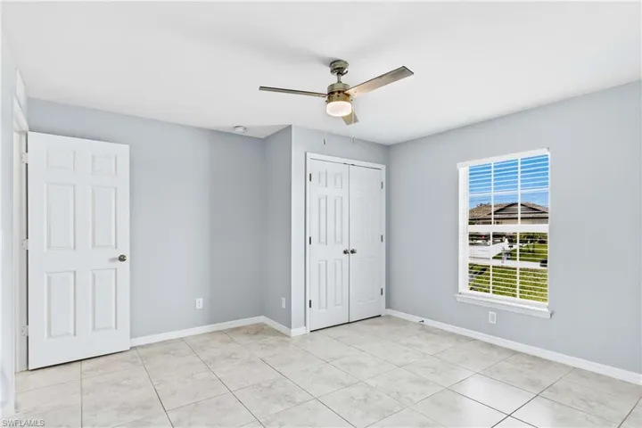 A generously sized secondary bedroom offers comfort, flexibility, and abundant natural light.