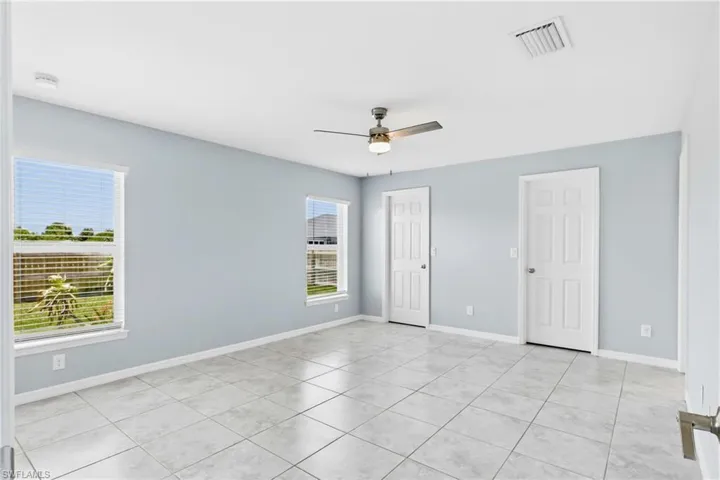 Your private retreat awaits with a spacious primary bedroom offering comfort, tranquility, and plenty of natural light.