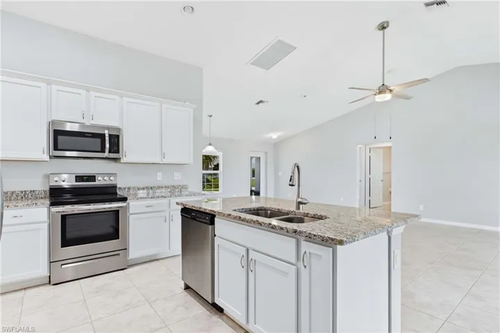 Featuring generous counter space, ample cabinetry, and an open layout, this kitchen is ready for everyday living and entertaining.