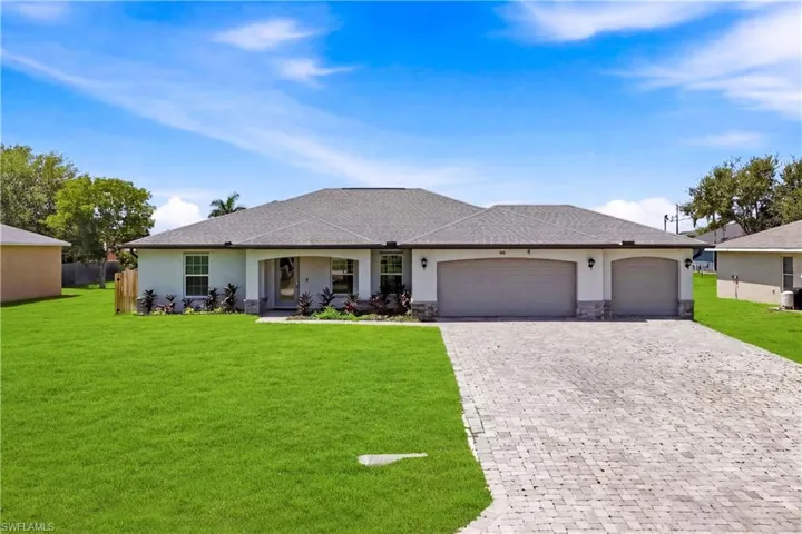 The oversized three-car garage offers exceptional space for vehicles, storage, hobbies, or your favorite recreational equipment.