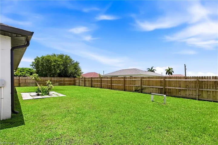 Enjoy added privacy and peace of mind in this spacious fenced backyard, perfect for relaxing, entertaining, and enjoying the Florida lifestyle.