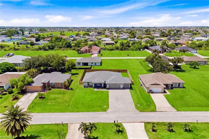 An aerial perspective highlights the home's attractive setting within one of Northwest Cape Coral's rapidly growing neighborhoods.