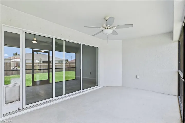 This covered lanai creates the ideal transition between indoor comfort and outdoor Florida living.