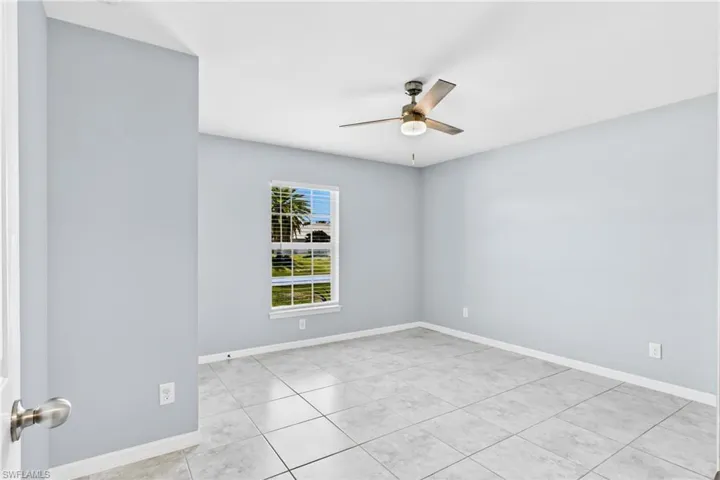 Bright and versatile, this guest bedroom is ideal for family, overnight guests, or a comfortable home office.