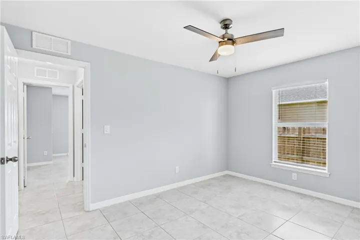 A beautifully maintained bedroom filled with natural light and endless possibilities.