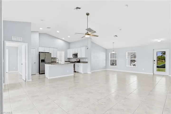 The expansive great room offers endless possibilities for relaxing, dining, and making lasting memories.