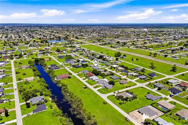 Aerial views showcase the generous lot and desirable southern rear exposure.
