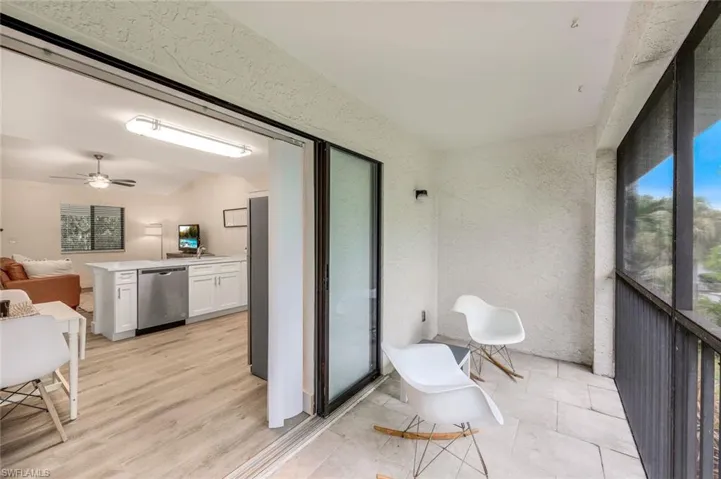 Balcony featuring ceiling fan