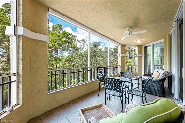 Sunroom with ceiling fan and a healthy amount of sunlight