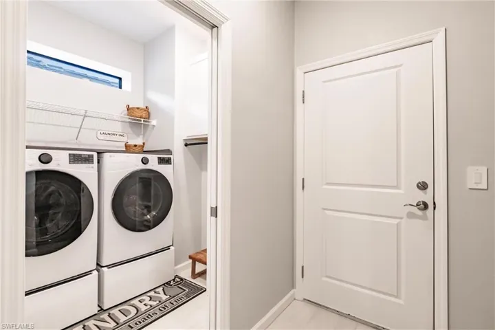Laundry with upgraded LG washer and dryer and shelving