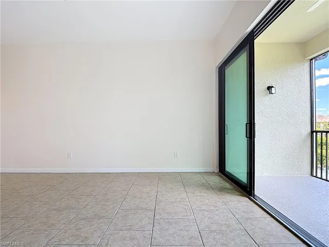 Spare room featuring light tile patterned floors