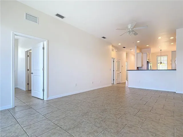Unfurnished living room with visible vents, recessed lighting, and ceiling fan