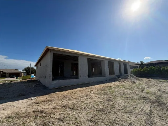 Back of property with concrete block siding