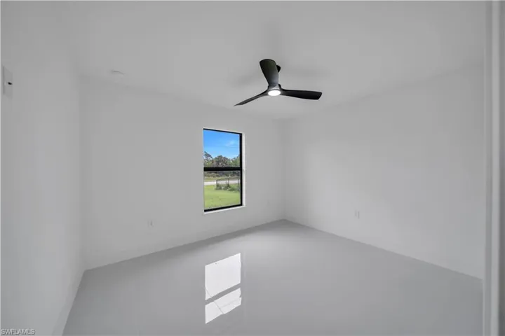 Spare room featuring a ceiling fan