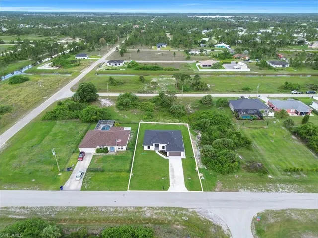 View of property location with nearby suburban area
