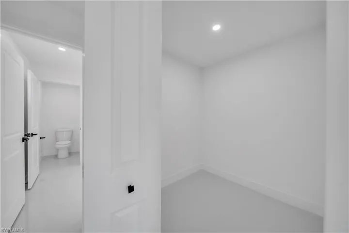 Bathroom with recessed lighting and toilet