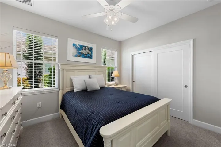 Bedroom #2 with carpet, NEW CEILING FAN (2017), and NEW WINDOW BLINDS (2017).