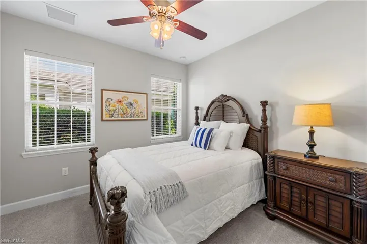Bedroom #3 with WALK-IN CLOSET, carpet, NEW CEILING FAN (2017), and NEW WINDOW BLINDS (2017).