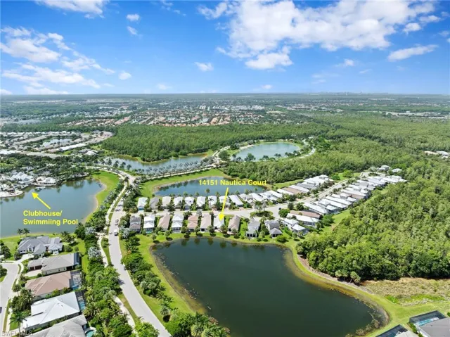 The charming home is within walking distance to the community clubhouse with restaurant, tiki bar, fire pit, lakefront beach, volleyball, community pool with lap lanes and fitness center.