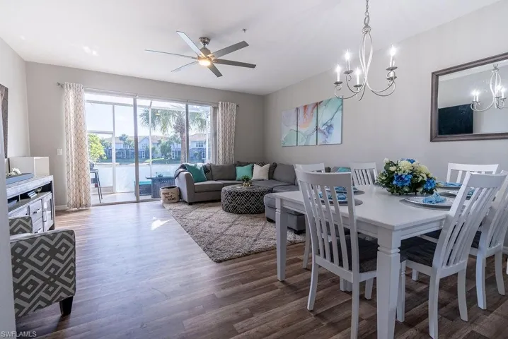 Dining area featuring wood finished floors and a ceiling fan