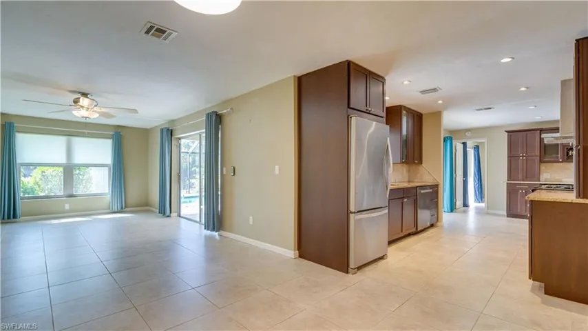 Kitchen featuring light tile floors, and stainless steel appliances